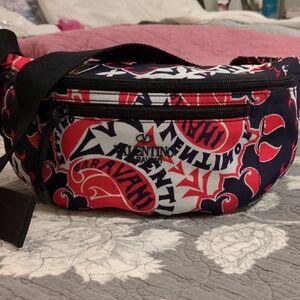 Valentino Garavani Black and Red Travel Bag with Bold Design